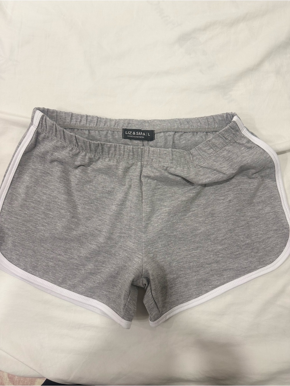 Liz & Saba Women's Grey Athletic Shorts with White Trim.